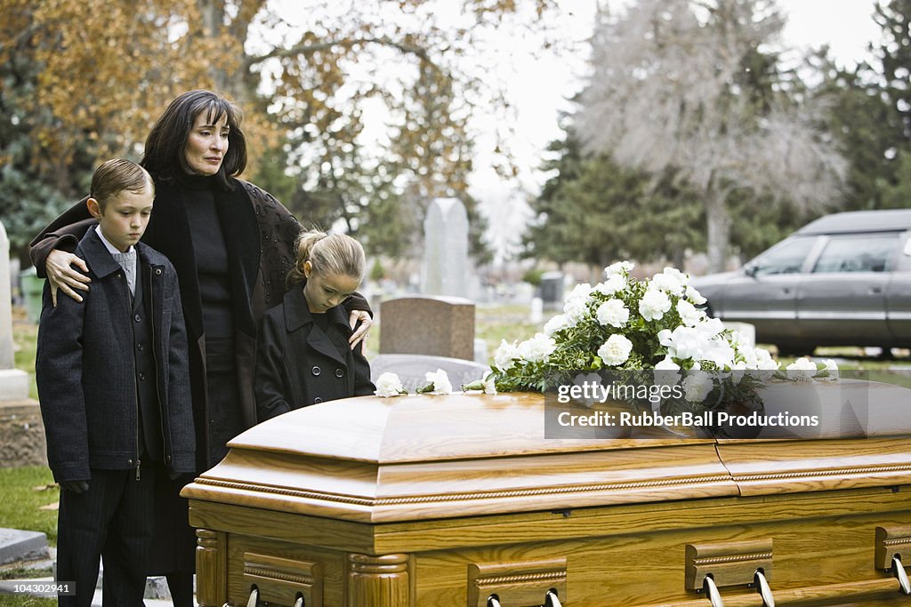 Mother and two children at a funeral