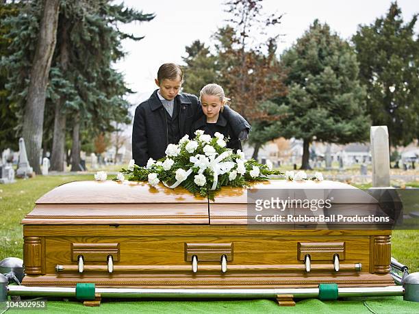 brother and sister at a funeral - funeral coffin stock pictures, royalty-free photos & images