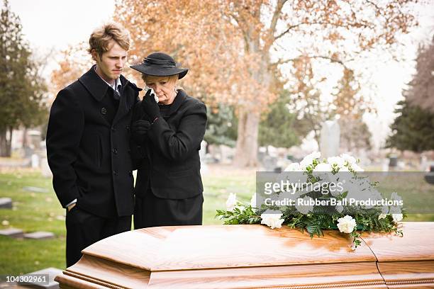 people at a funeral - mourning stock pictures, royalty-free photos & images