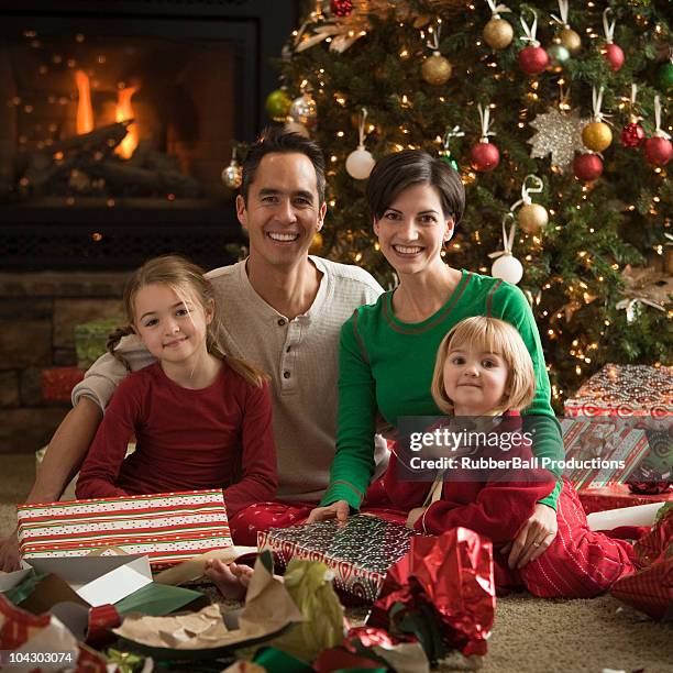 family opening presents at christmas - open day 8 stock pictures, royalty-free photos & images