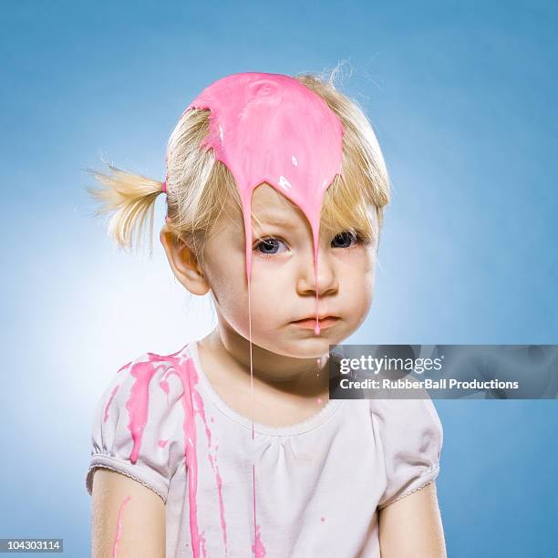 girl getting goo poured on her head - food fight stock pictures, royalty-free photos & images