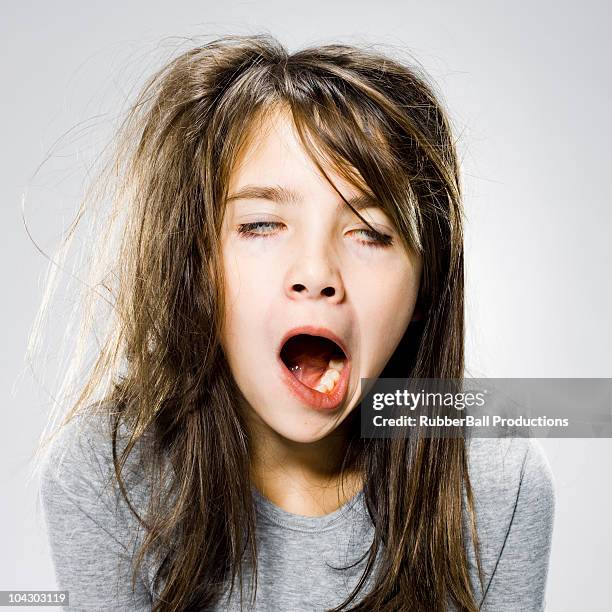 girl waking up in the morning - yawning stock-fotos und bilder