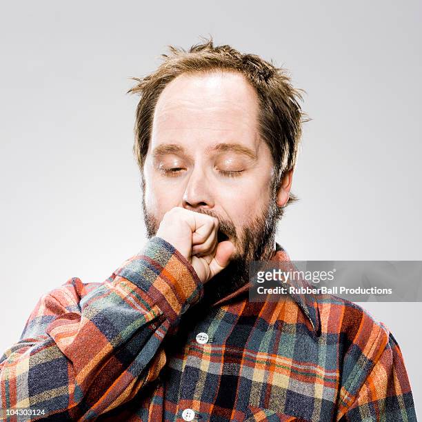 man in a plaid shirt - yawning stock pictures, royalty-free photos & images