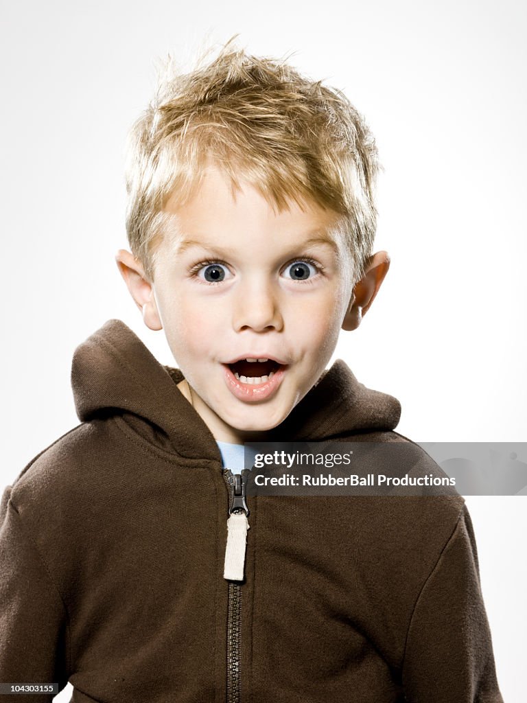 Boy looking at the camera in disebelief