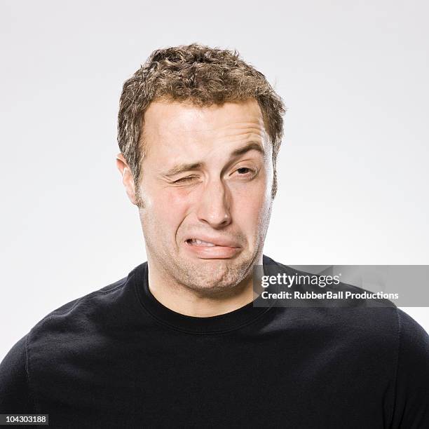 man making a disgusted face - bitter stock pictures, royalty-free photos & images