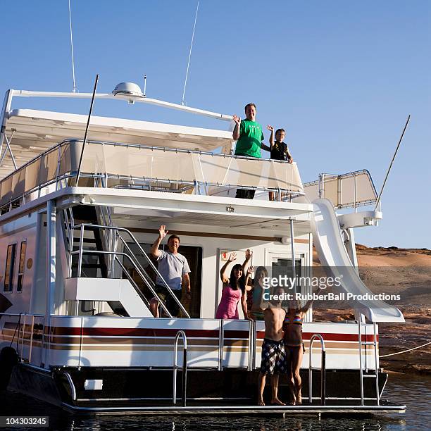 people on a houseboat on lake powell - lake powell stock-fotos und bilder