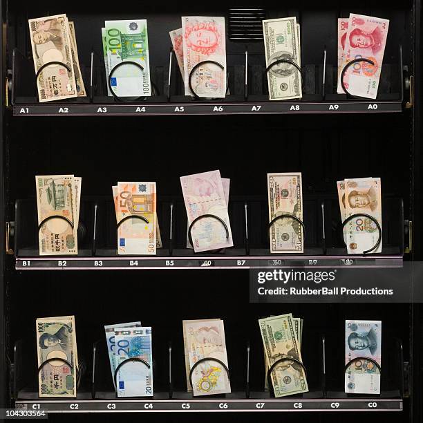 currency in a vending machine - euro dollar stockfoto's en -beelden