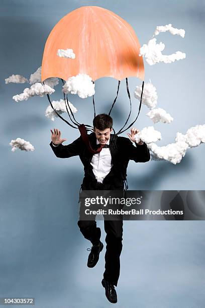 businessman parachuting - portrait looking down stock pictures, royalty-free photos & images