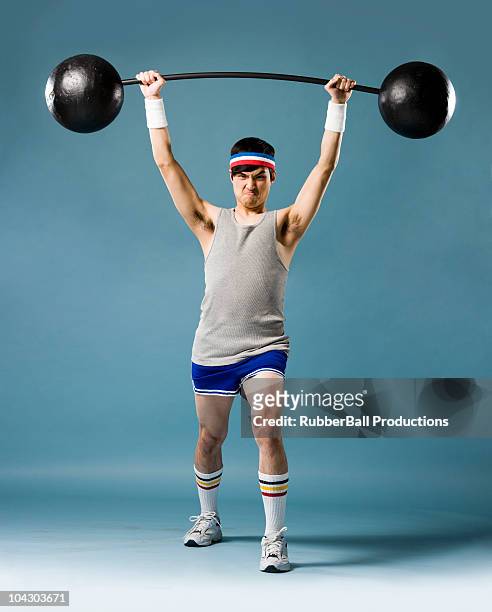 man lifting weights - gray shorts stock pictures, royalty-free photos & images