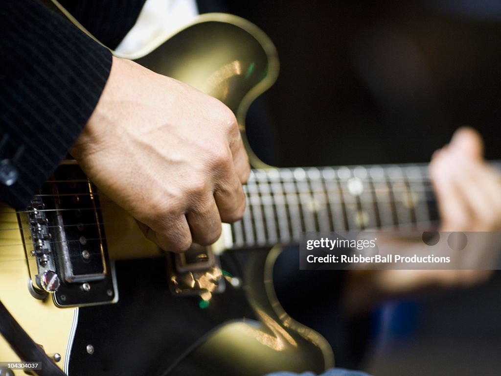 Man playing a guitar