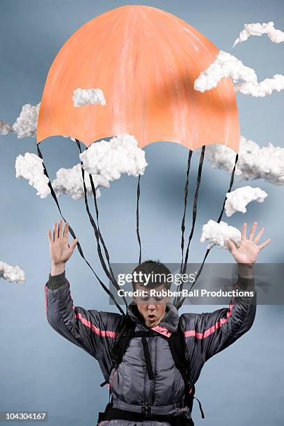 Man In A Jumpsuit Parachuting High-Res Stock Photo
