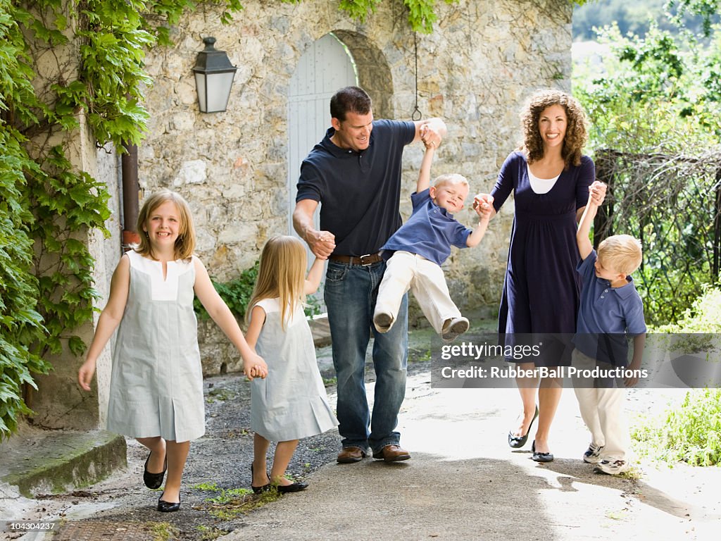 Family on a cobblestone street