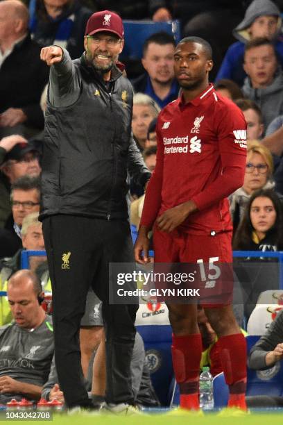 Liverpool's German manager Jurgen Klopp instructs Liverpool's English striker Daniel Sturridge during the English Premier League football match...