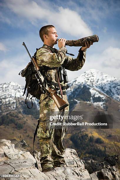 man hunting in the wilderness - hunting horn stock pictures, royalty-free photos & images