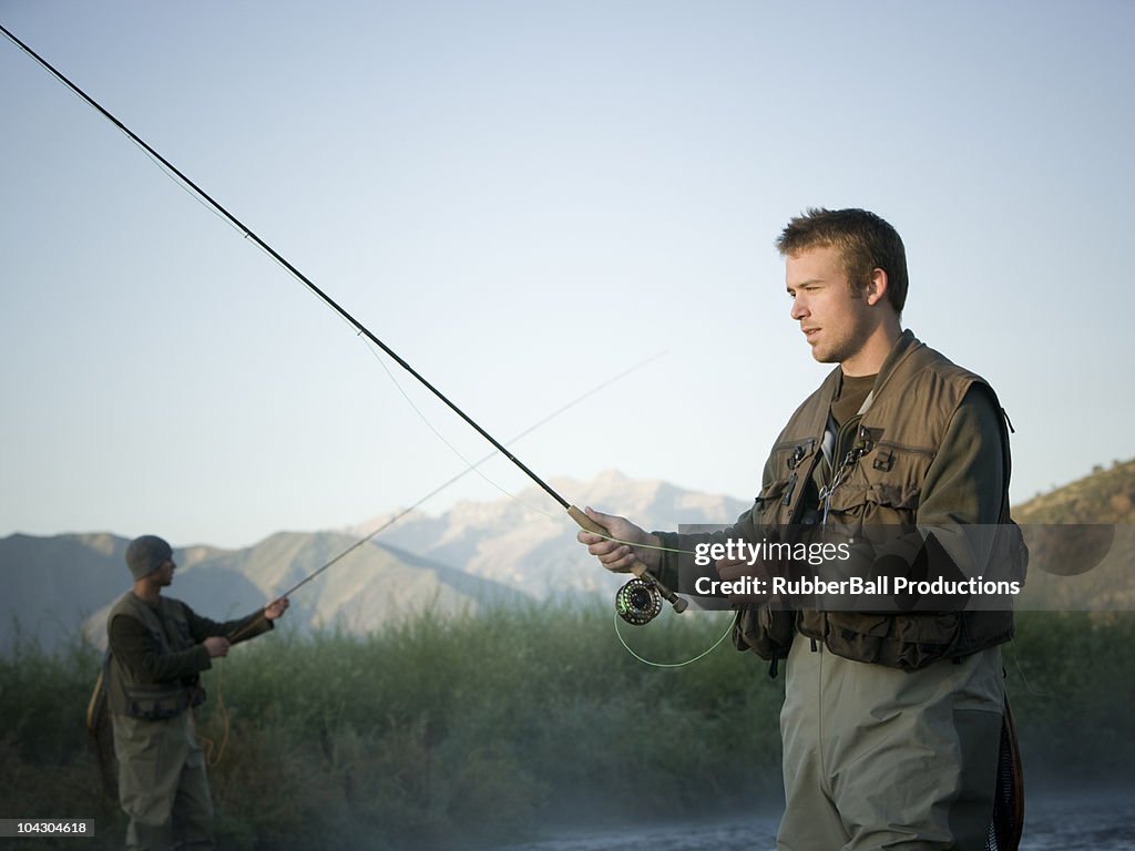 Fly fisherman fishing in a mountain river