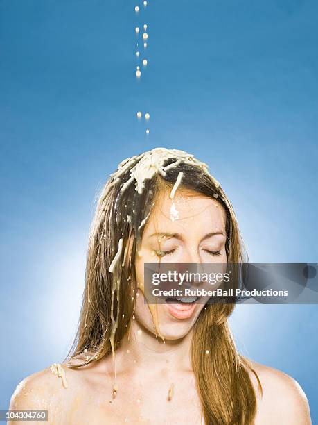 woman getting soup poured on her head - food fight stock pictures, royalty-free photos & images