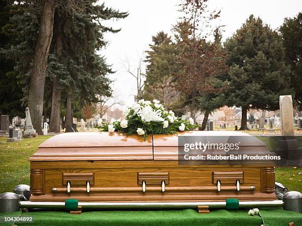 coffin at a cemetery - funeral stockfoto's en -beelden