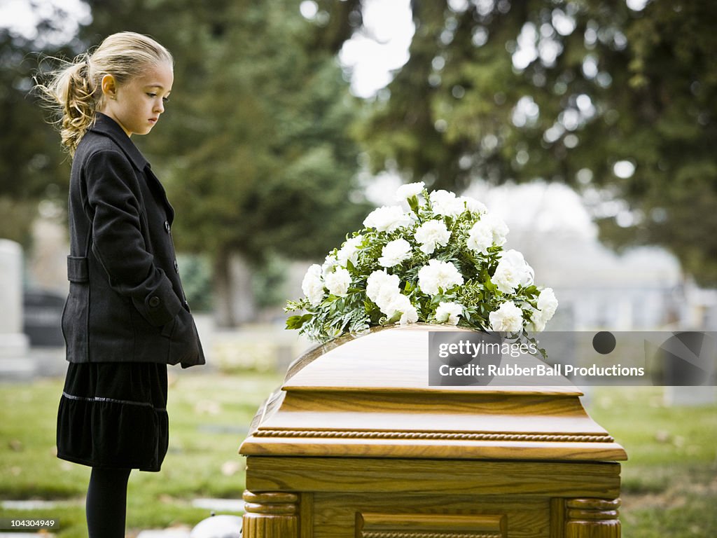 Girl at a funeral in a cemetery