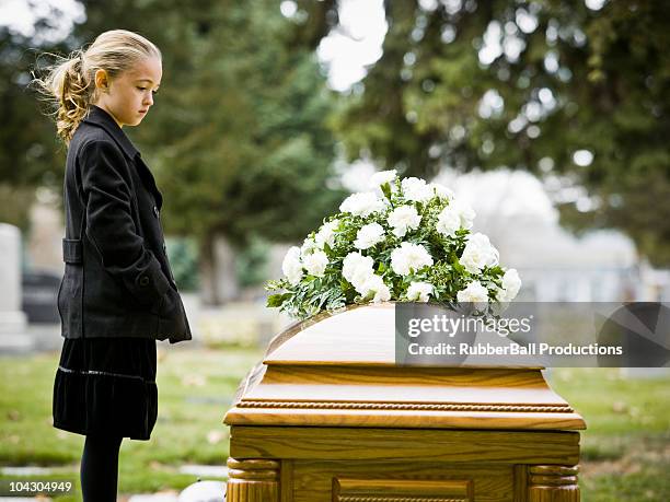 girl at a funeral in a cemetery - coffin stock pictures, royalty-free photos & images