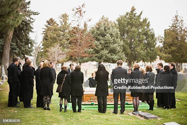 outdoor shot of funeral - mourner stock pictures, royalty-free photos & images