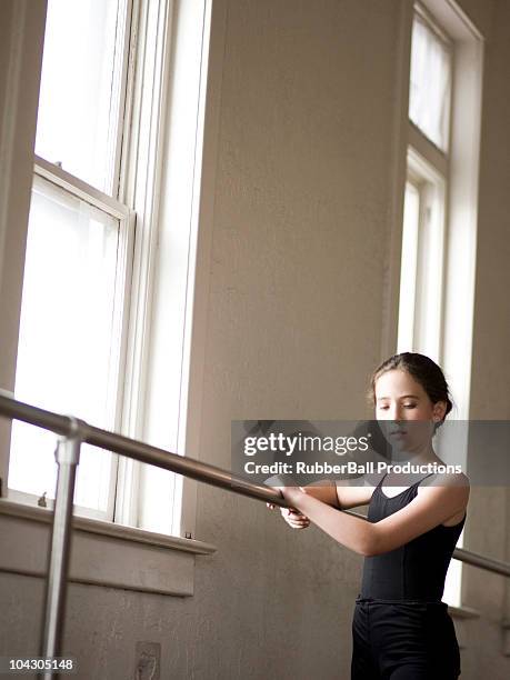 usa,utah,springville,girl ballet dancer (12-13) using railing - springville utah stock pictures, royalty-free photos & images