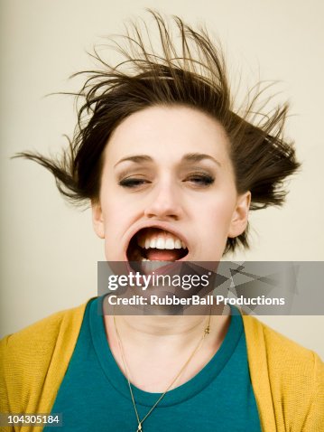 Person getting wind blown in the face Person getting wind blown in the face