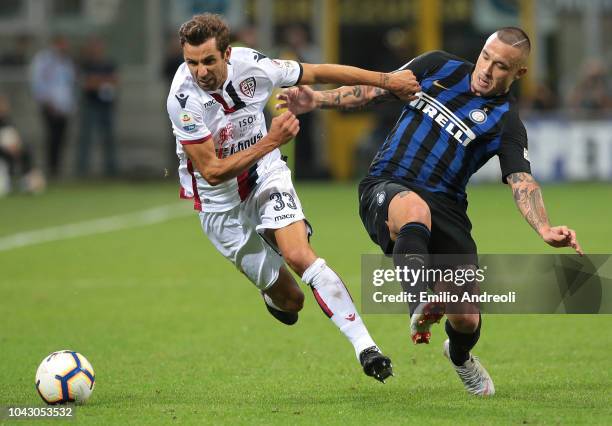 Darijo Srna of Cagliari Calcio is challenged by Radja Nainggolan of FC Internazionale during the Serie A match between FC Internazionale and Cagliari...