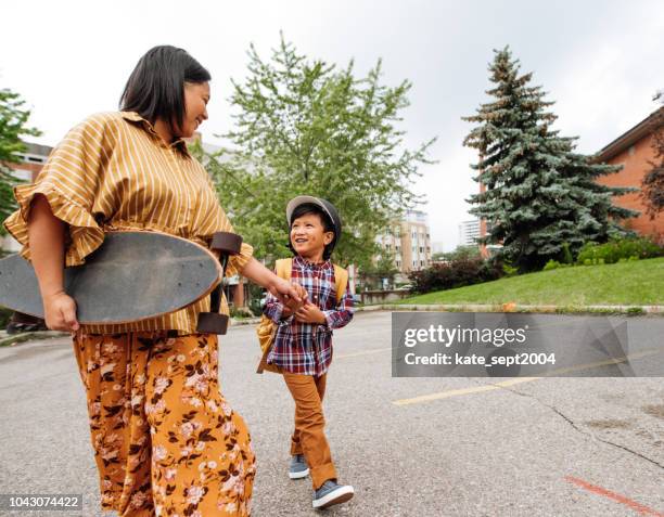 back to school - holding skateboard stock pictures, royalty-free photos & images