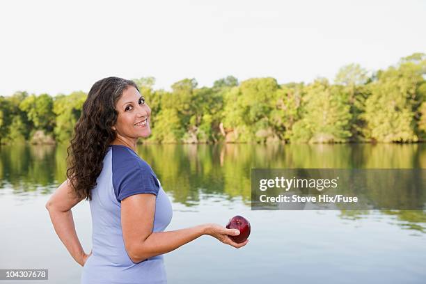 woman beside a lake - voluptuous stock pictures, royalty-free photos & images