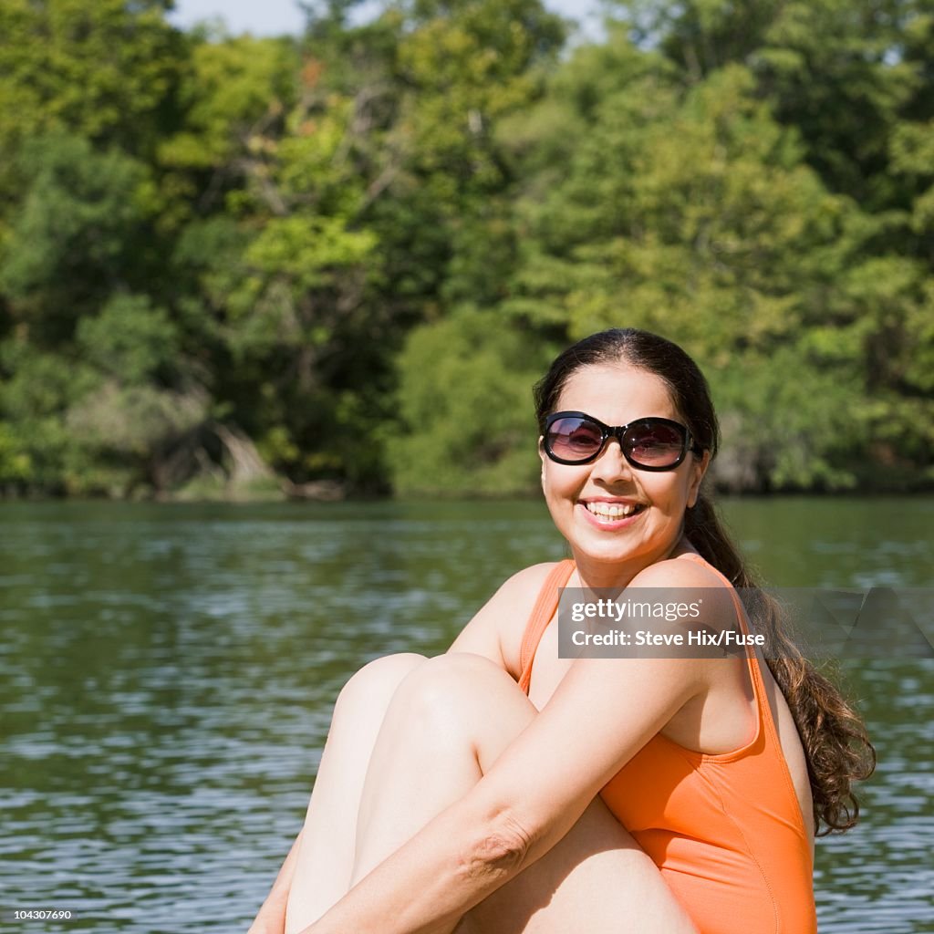 Woman beside a lake