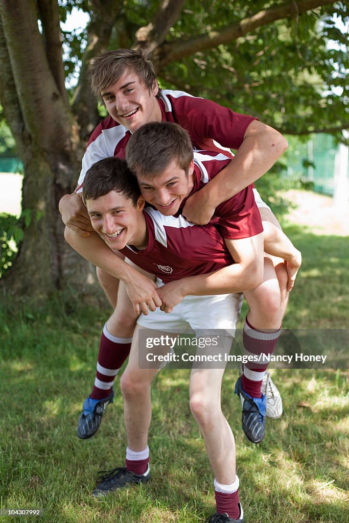 Group of young men horsing around