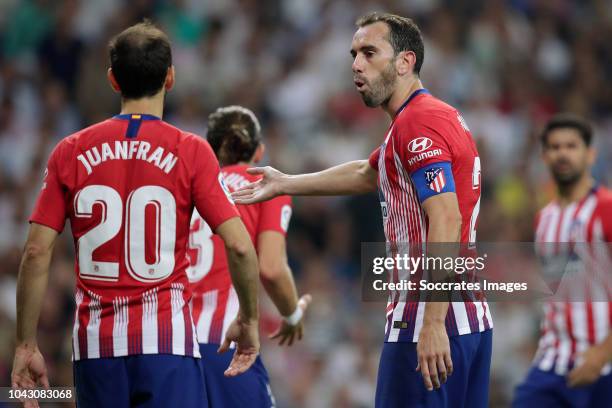 Juanfran of Atletico Madrid, Diego Godin of Atletico Madrid during the La Liga Santander match between Real Madrid v Atletico Madrid at the Santiago...