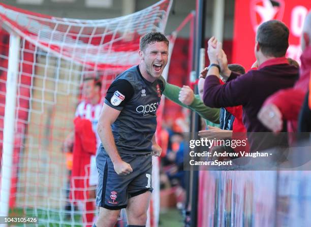 Lincoln City's Shay McCartan celebrates scoring his side's second goal during the Sky Bet League Two match between Cheltenham Town and Lincoln City...