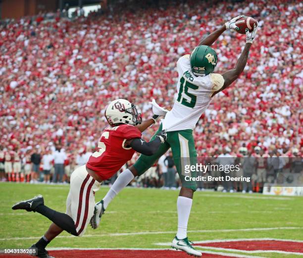 Wide receiver Denzel Mims of the Baylor Bears catches a touchdown in front of cornerback Tre Brown of the Oklahoma Sooners at Gaylord Family Oklahoma...