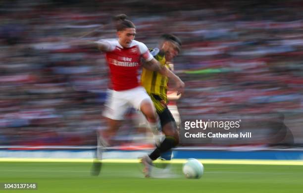 Hector Bellerin of Arsenal is tackled during the Premier League match between Arsenal FC and Watford FC at Emirates Stadium on September 29, 2018 in...