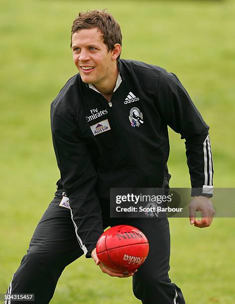 Luke Ball of the Magpies passes the ball during a Collingwood Magpies AFL recovery session at St Kilda Sea Baths on September 21, 2010 in Melbourne,...