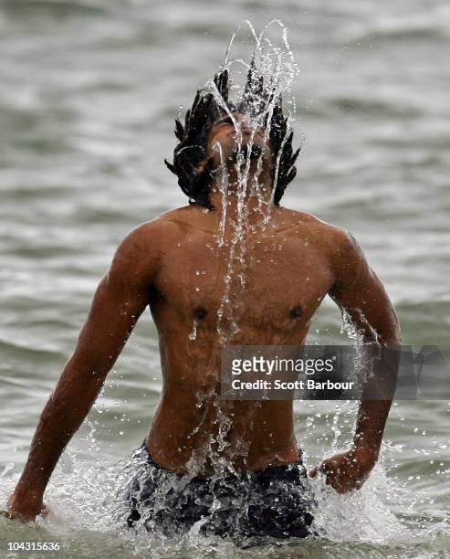 Harry O'Brien of the Magpies dives into the water during a Collingwood Magpies AFL recovery session at St Kilda Sea Baths on September 21, 2010 in...