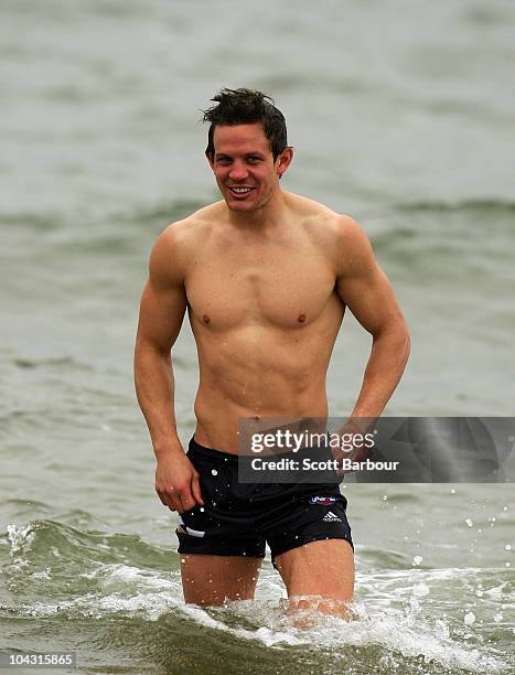 Luke Ball of the Magpies walks out of the water during a Collingwood Magpies AFL recovery session at St Kilda Sea Baths on September 21, 2010 in...