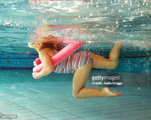 young girl swimming at the pool - swimming stock-fotos und bilder