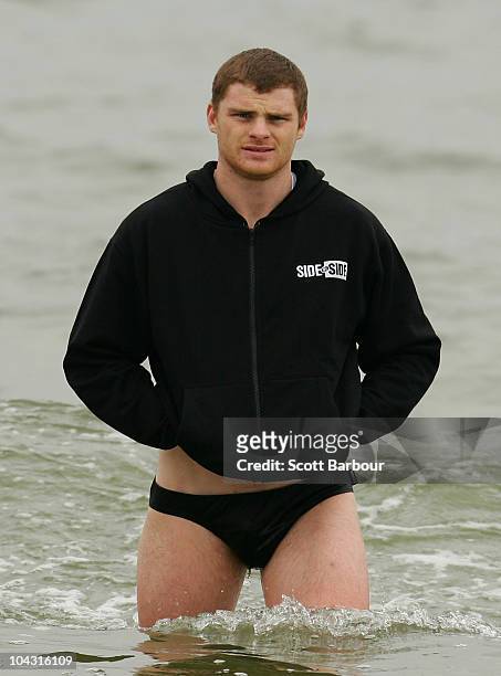 Heath Shaw of the Magpies walks out of the water during a Collingwood Magpies AFL recovery session at St Kilda Sea Baths on September 21, 2010 in...