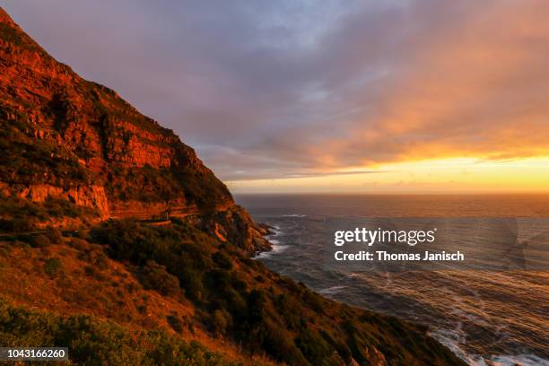 chapman's peak drive during sunset, western cape - chapmans peak stock pictures, royalty-free photos & images