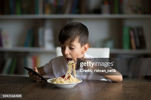 Boy eating spaghetti Boy eating spaghetti