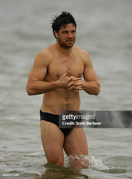 Paul Medhurst of the Magpies walks out of the water during a Collingwood Magpies AFL recovery session at St Kilda Sea Baths on September 21, 2010 in...