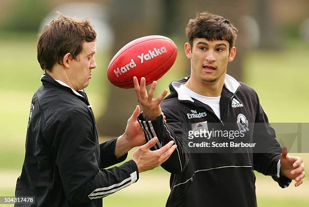 Luke Ball and Sharrod Wellingham of the Magpies take part in a training exercise during a Collingwood Magpies AFL recovery session at St Kilda Sea...