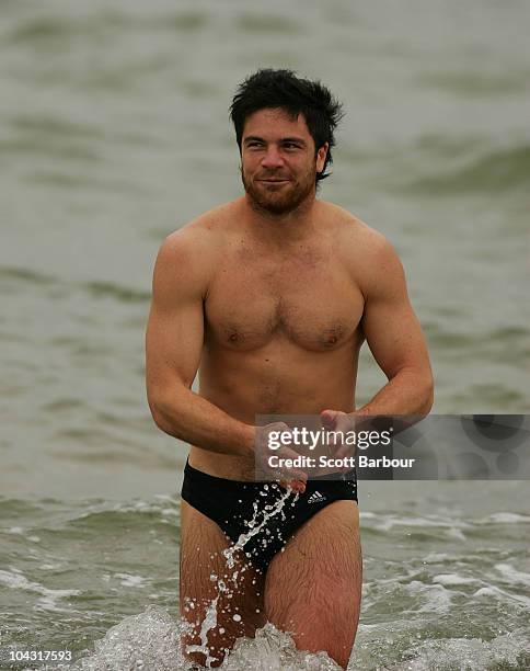 Paul Medhurst of the Magpies walks out of the water during a Collingwood Magpies AFL recovery session at St Kilda Sea Baths on September 21, 2010 in...