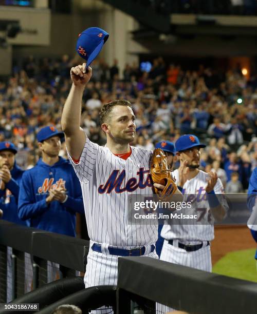 David Wright of the New York Mets acknowledges the crowd as he is removed from the final game of his career during the fifth inning against the Miami...