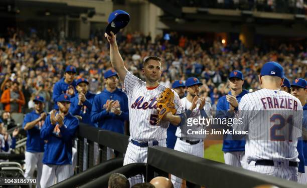 David Wright of the New York Mets acknowledges the crowd as he is removed from the final game of his career during the fifth inning against the Miami...