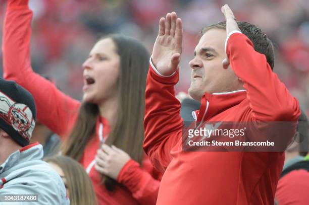 Fans of the Nebraska Cornhuskers react to a penalty call in the game against the Purdue Boilermakers in the second half at Memorial Stadium on...