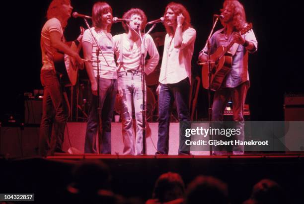 Joe Walsh, Randy Meisner, Don Henley, Glenn Frey and Don Felder of The Eagles sing harmony while performing on stage at Ahoy on 11th May 1977 in...
