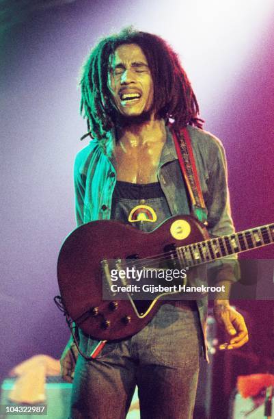 Bob Marley performs on stage with The Wailers at Houtrust Hallen on 13th May 1977 in The Hauge, Netherlands. He plays a Gibson Les Paul Special...